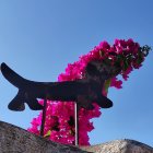 Two Animated Dogs in Matching Pink Jackets Against Blue Sky