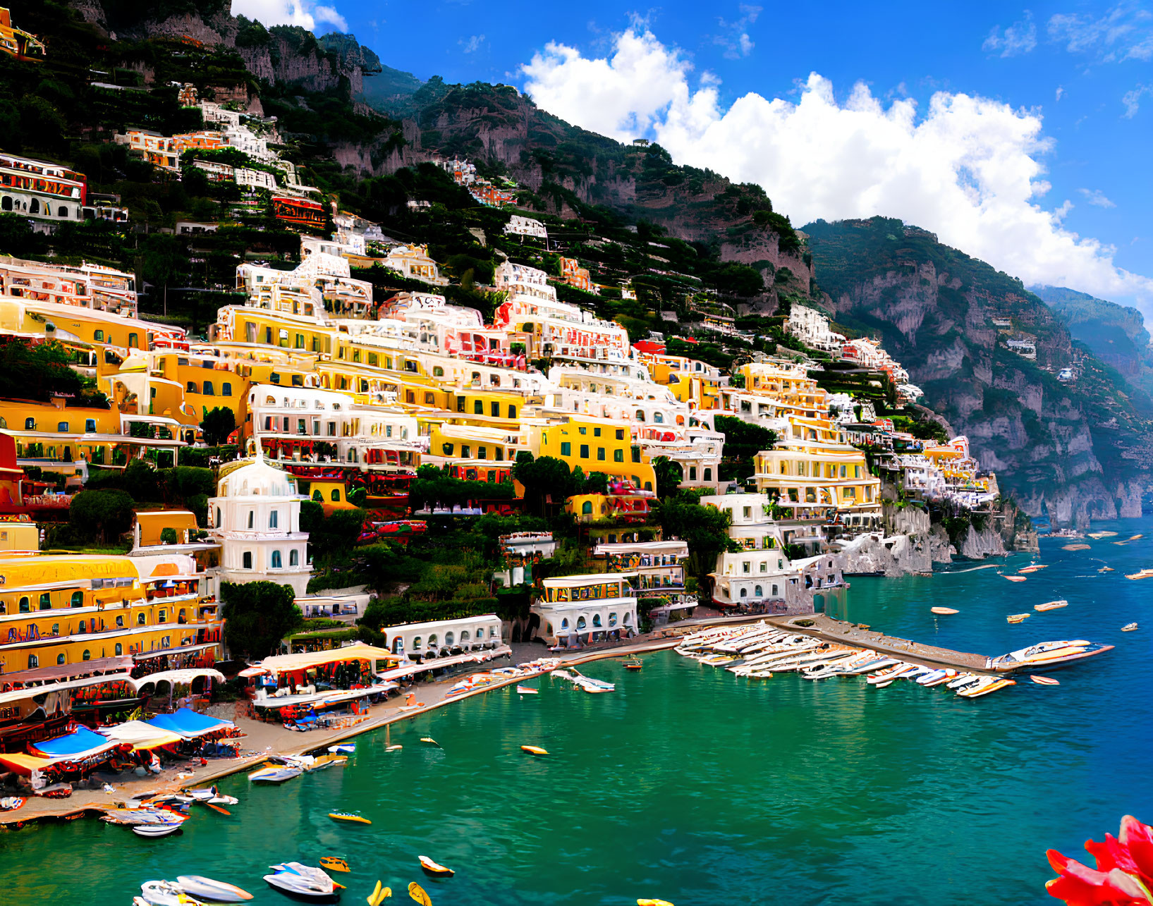 Vibrant Hillside Buildings Overlooking Blue Sea