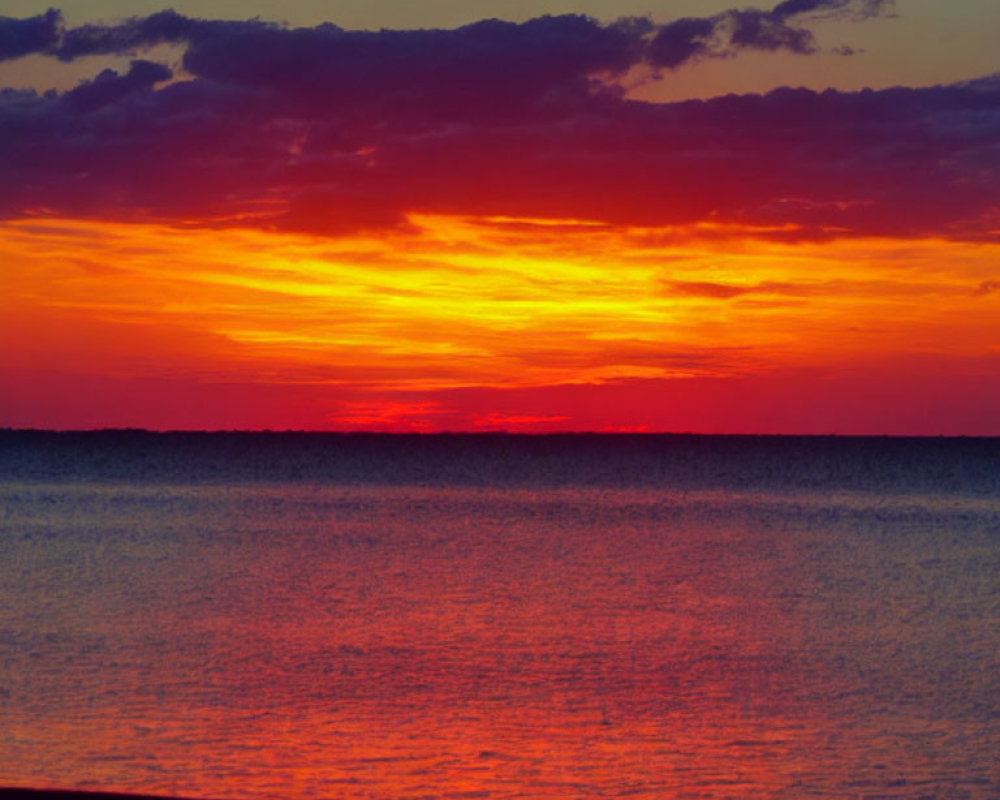 Tranquil Sunset Scene with Red and Orange Reflections