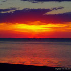 Tranquil Sunset Scene with Red and Orange Reflections