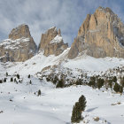 Surreal winter landscape with golden-robed figure and ornate buildings