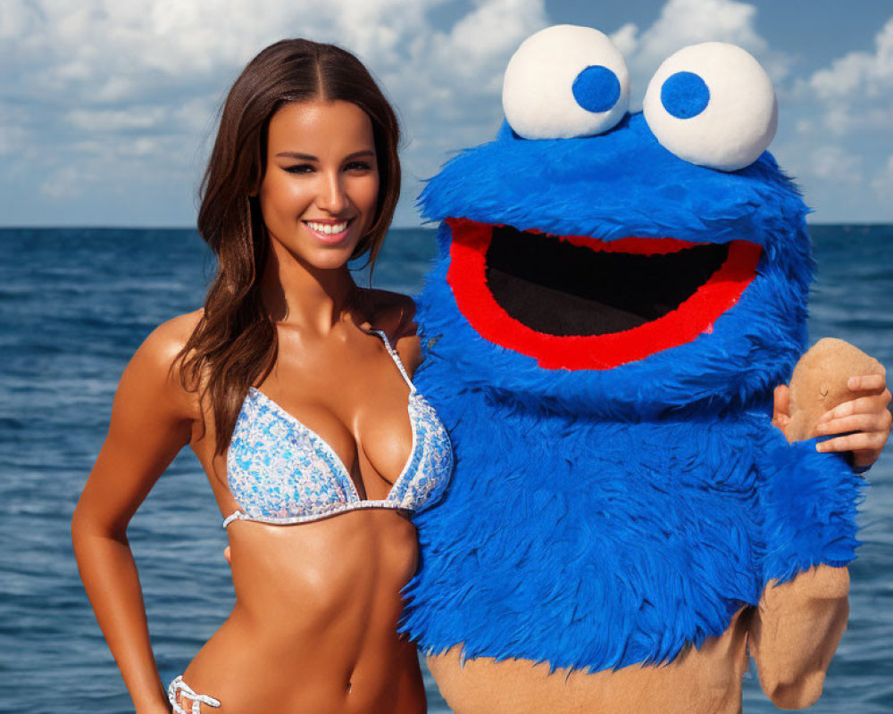 Woman in Blue Bikini Poses with Cookie Monster Costume at Ocean