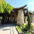 Whimsical hobbit-like houses in lush green landscape