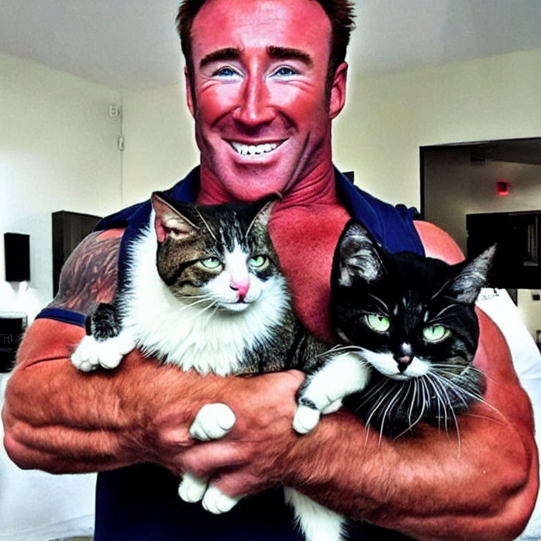 Smiling man with tanned skin holding two cats with unique facial markings