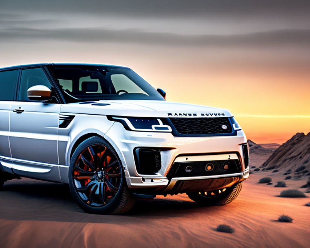 White Range Rover parked in sandy desert at sunset