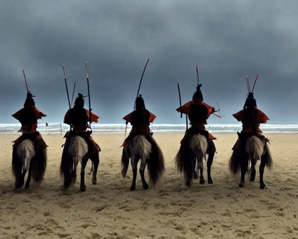 Group of individuals in red traditional attire riding horses on a beach under a cloudy sky, some holding spe