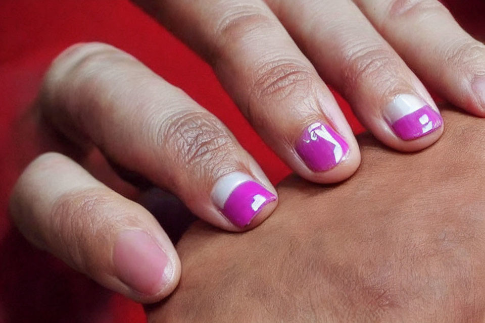 Detailed Close-up of Purple and White French Tip Manicured Nails