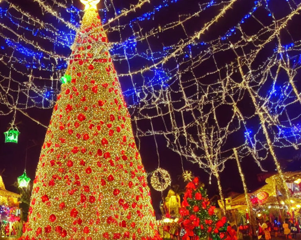 Festive Christmas tree with red ornaments and golden star in blue light