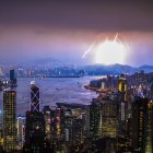 Surreal cityscape with thunderstorm, lightning, starry sky, and harbor ships