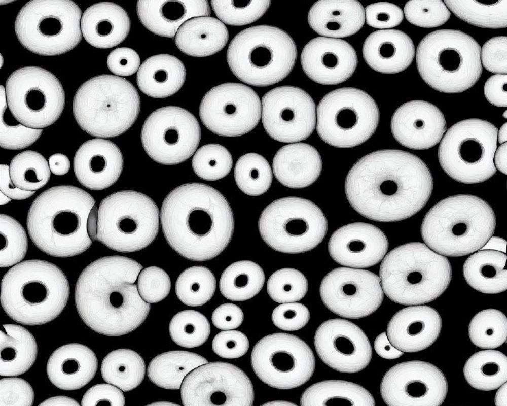 Monochrome Pattern of Stylized Eyes on Black Background