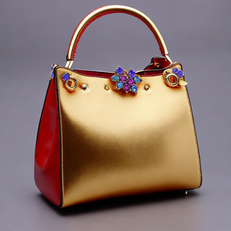 Gold-to-Red Gradient Handbag with Floral Brooch and Circular Handles on Grey Background