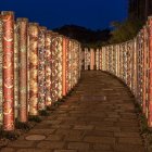 Enchanted garden at dusk with golden gates and vibrant flowers