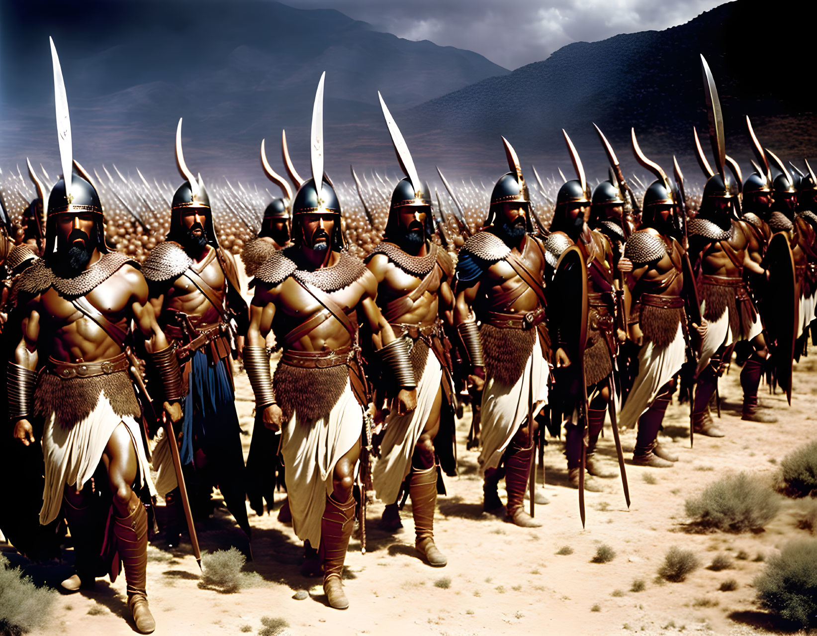 Spartan warriors in capes and helmets with spears and shields in desert battlefield