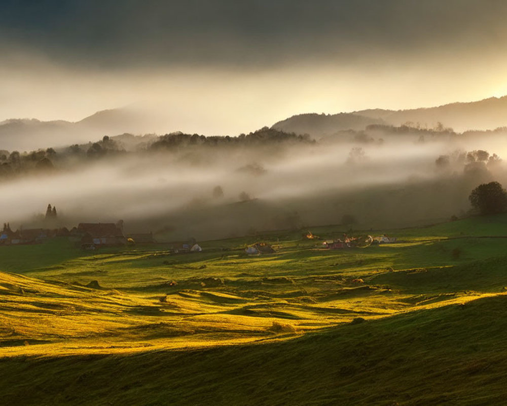 Scenic sunset over green hills with fog, village, and trees