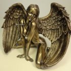 Golden angelic figure with wings and crown in shiny armor - 3D illustration