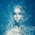 Portrait of Woman with Blue Hair and Translucent Bubbles in Ethereal Underwater Scene