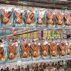 Colorful Easter Bunnies and Chocolate Eggs Displayed on Shelves