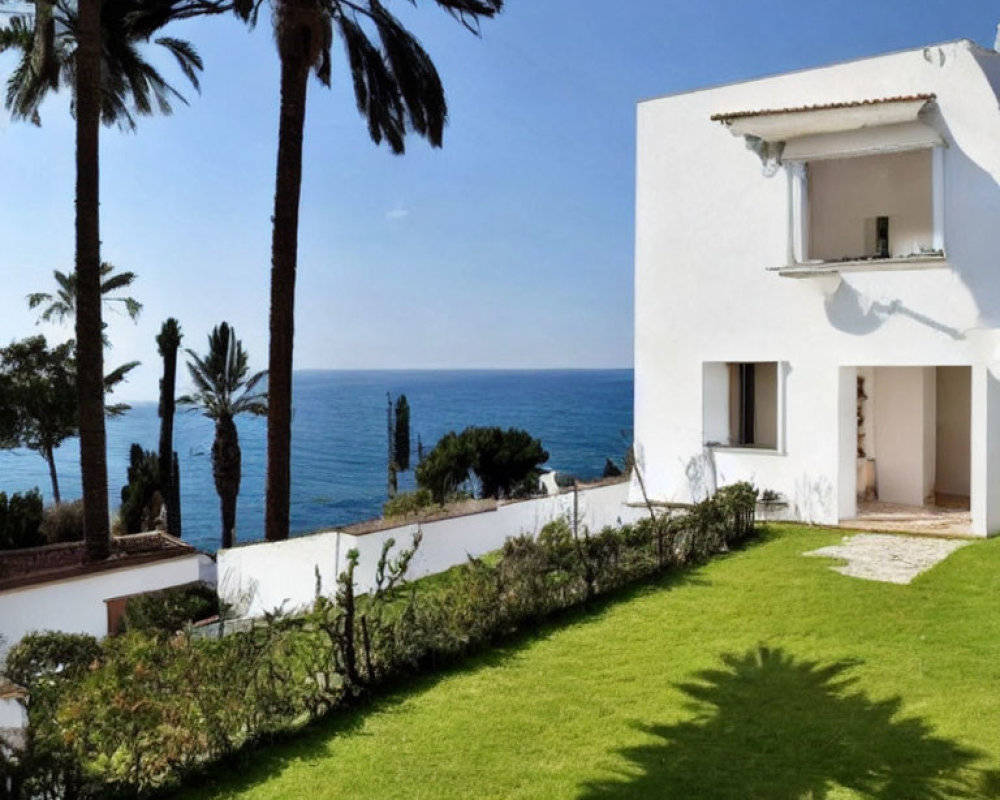 White Villa with Sea View, Lush Lawn, Palm Trees, and Clear Sky