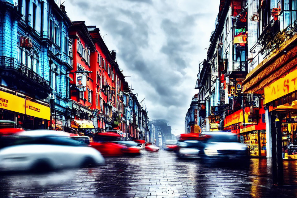 Colorful city street with blurred cars under gloomy sky