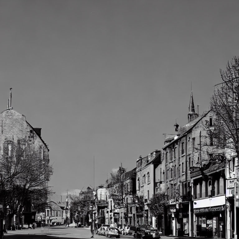 Monochrome urban street scene with low-rise buildings