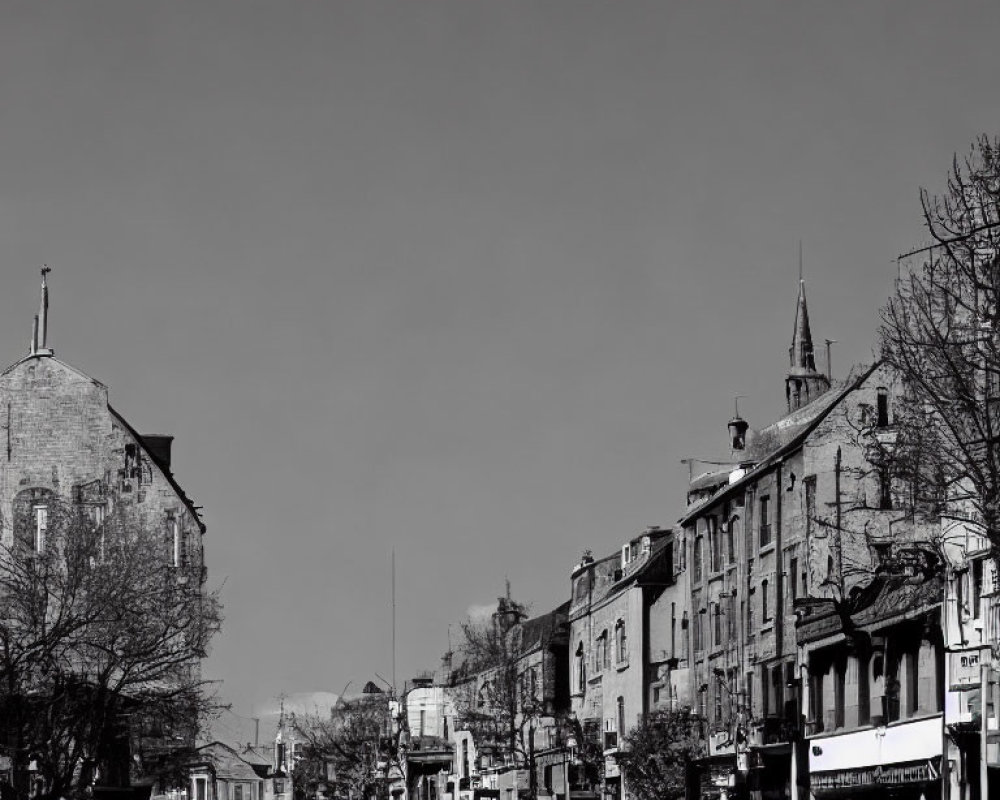 Monochrome urban street scene with low-rise buildings