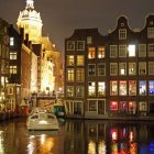 Half-Timbered Houses Illuminated by River at Night