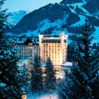 Snow-covered buildings and trees in majestic mountain landscape