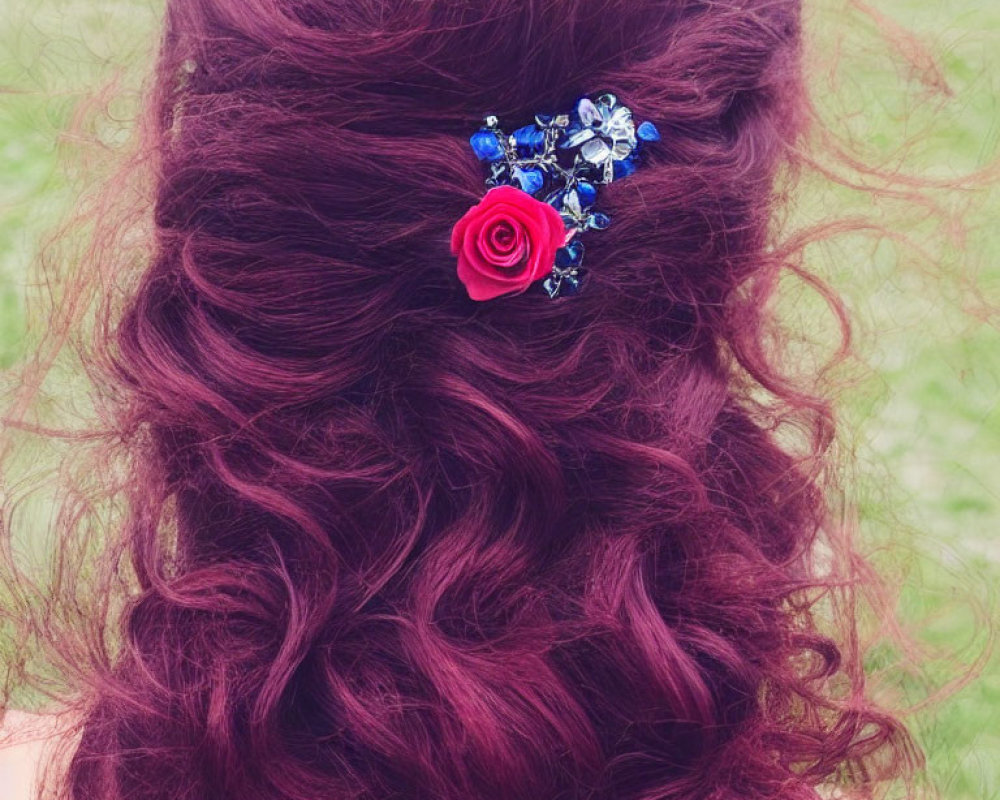 Wavy Burgundy Hair with Floral Hair Accessory on Green Background