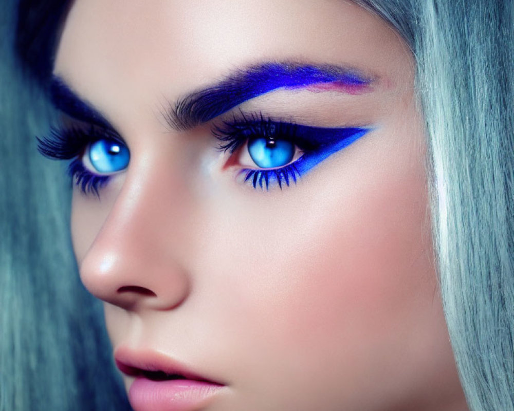 Person with Striking Blue Eyes, Blue and Purple Eyeshadow, Silver Hair