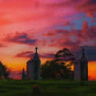 Sunset scene at peaceful cemetery with orange and pink sky hues over ornate gravestones.