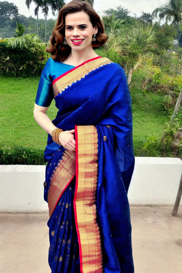 Traditional Indian Blue Saree with Red and Gold Border Outfit Smiling Outdoors