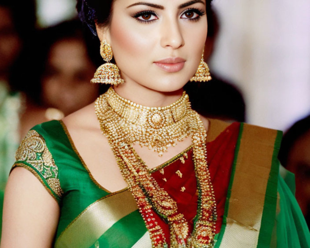 Traditional Indian Attire with Green Saree and Gold Jewelry