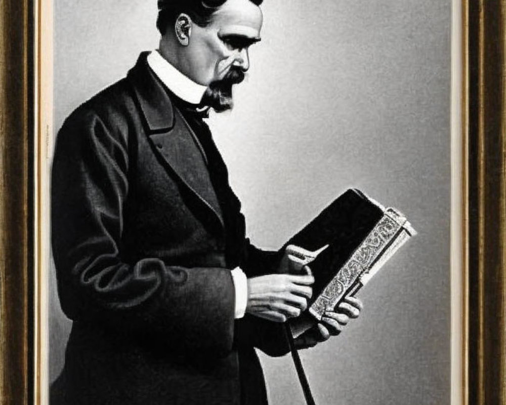 Monochrome portrait of bearded man in suit with open book, framed on wall