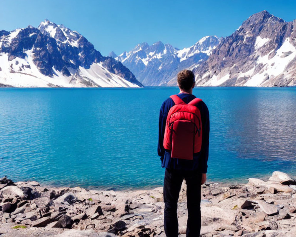Person with Red Backpack by Serene Blue Mountain Lake