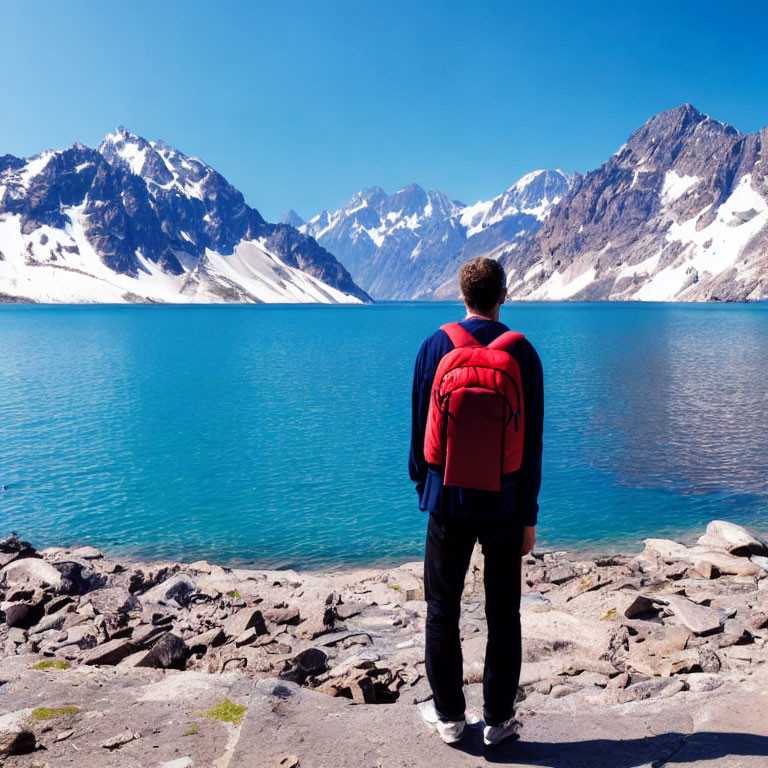 Person with Red Backpack by Serene Blue Mountain Lake