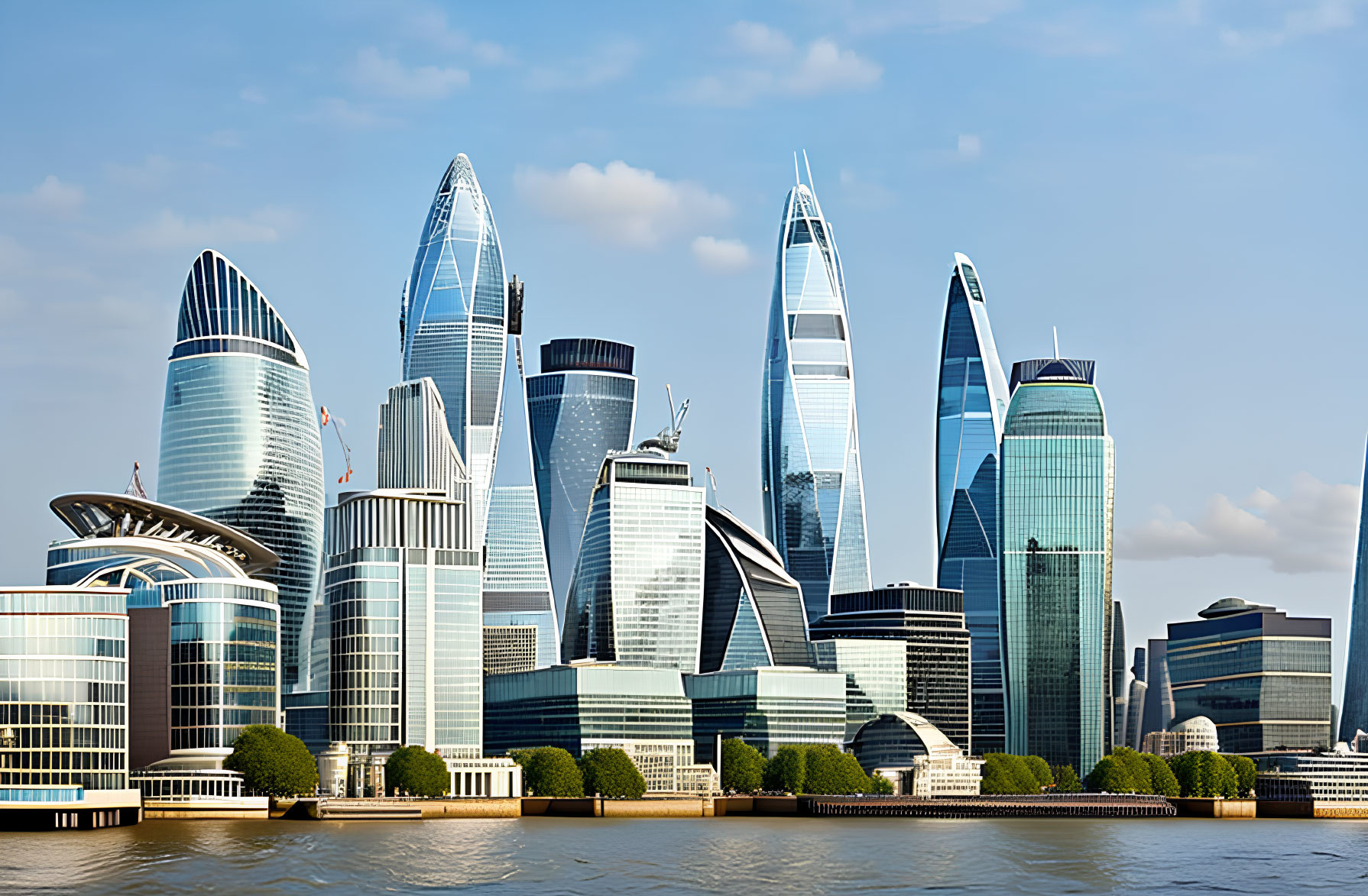 City skyline featuring unique skyscrapers along a river on a clear day.