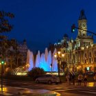 Illuminated Fountain with Blue Lights at Dusk