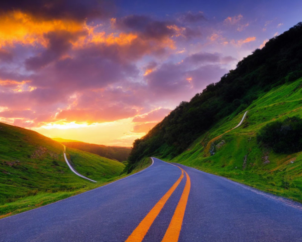 Scenic sunset over lush green hills on winding road