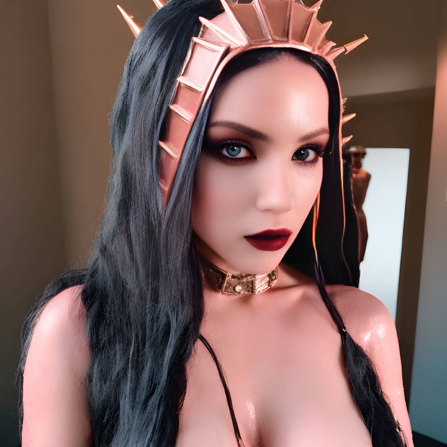 Dark-haired woman in spiked crown with dramatic makeup and choker.