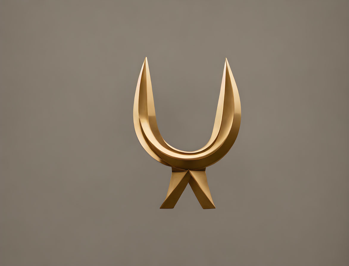 Golden three-dimensional emblem with pointed extensions on grey background