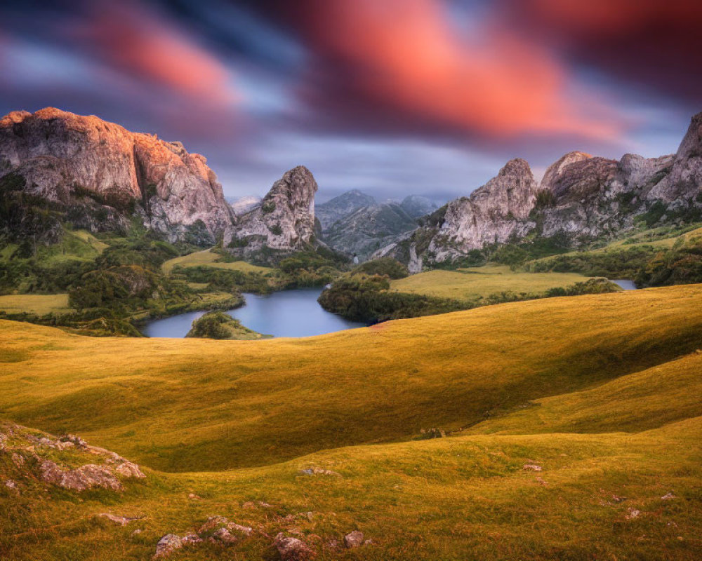 Tranquil landscape with green hills, serene lake, mountains, vibrant sunrise