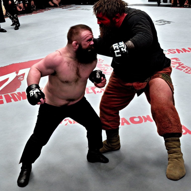 Two men wrestling in a ring with spectators and logos.