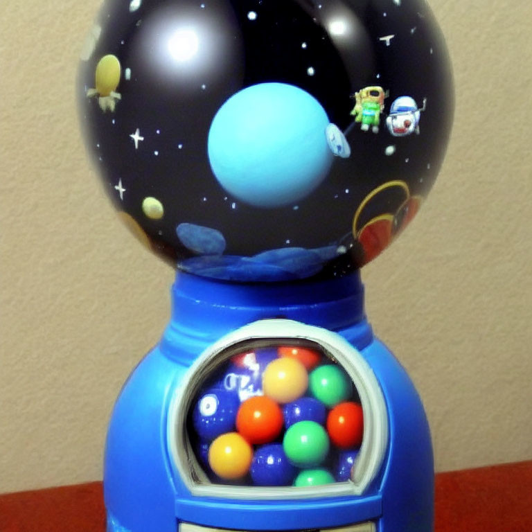 Space-themed gumball machine with celestial bodies and astronaut on blue base