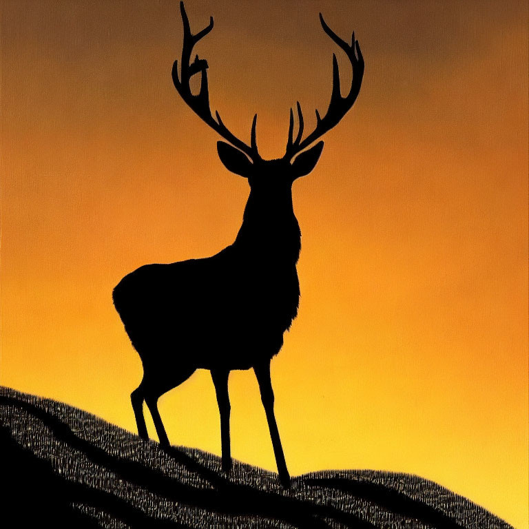 Majestic deer silhouette with large antlers at sunset