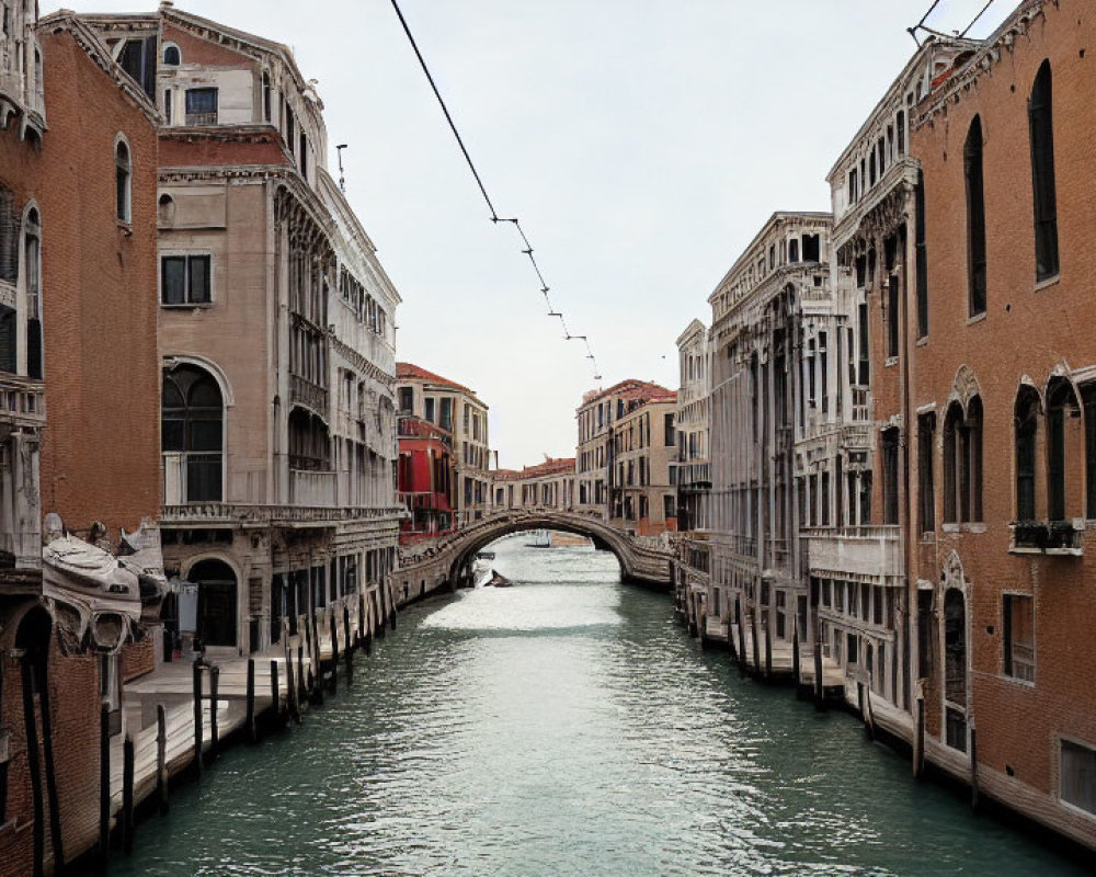 Historic buildings and bridge over canal in Venice.