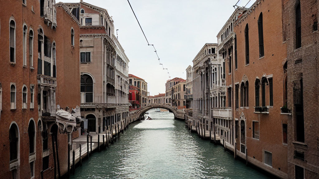 Historic buildings and bridge over canal in Venice.