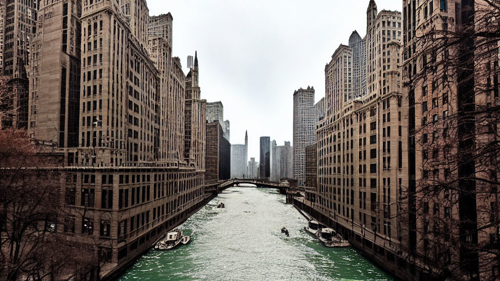 City river scene with skyscrapers, boats, and cloudy sky.