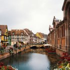 Futuristic cityscape with canal, boats, and waterfront buildings