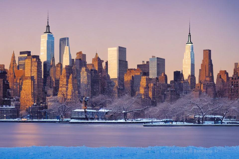 Snow-dusted New York City skyline at winter sunrise