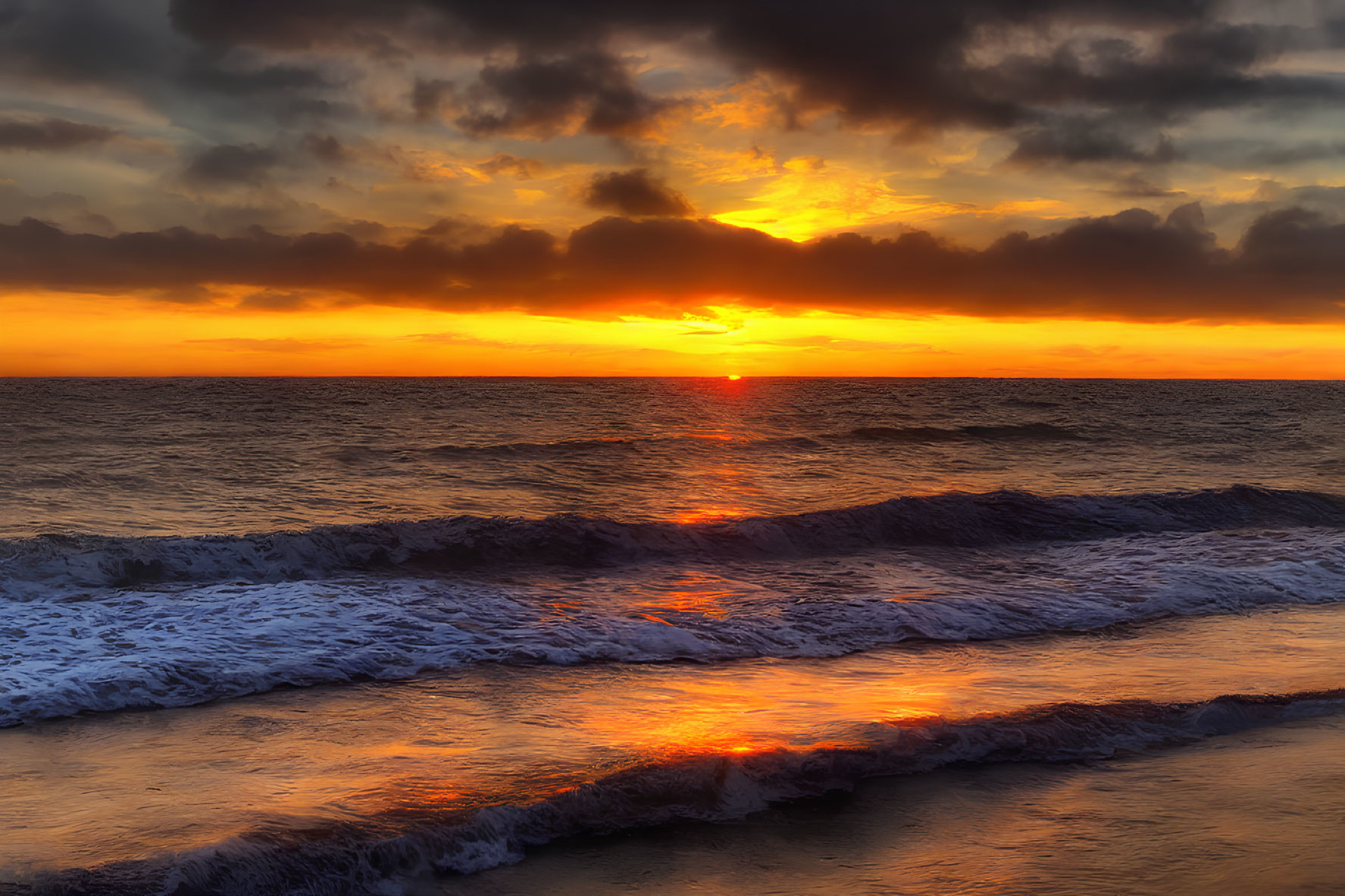 Fiery Orange and Yellow Sunset Reflection on Ocean Waves